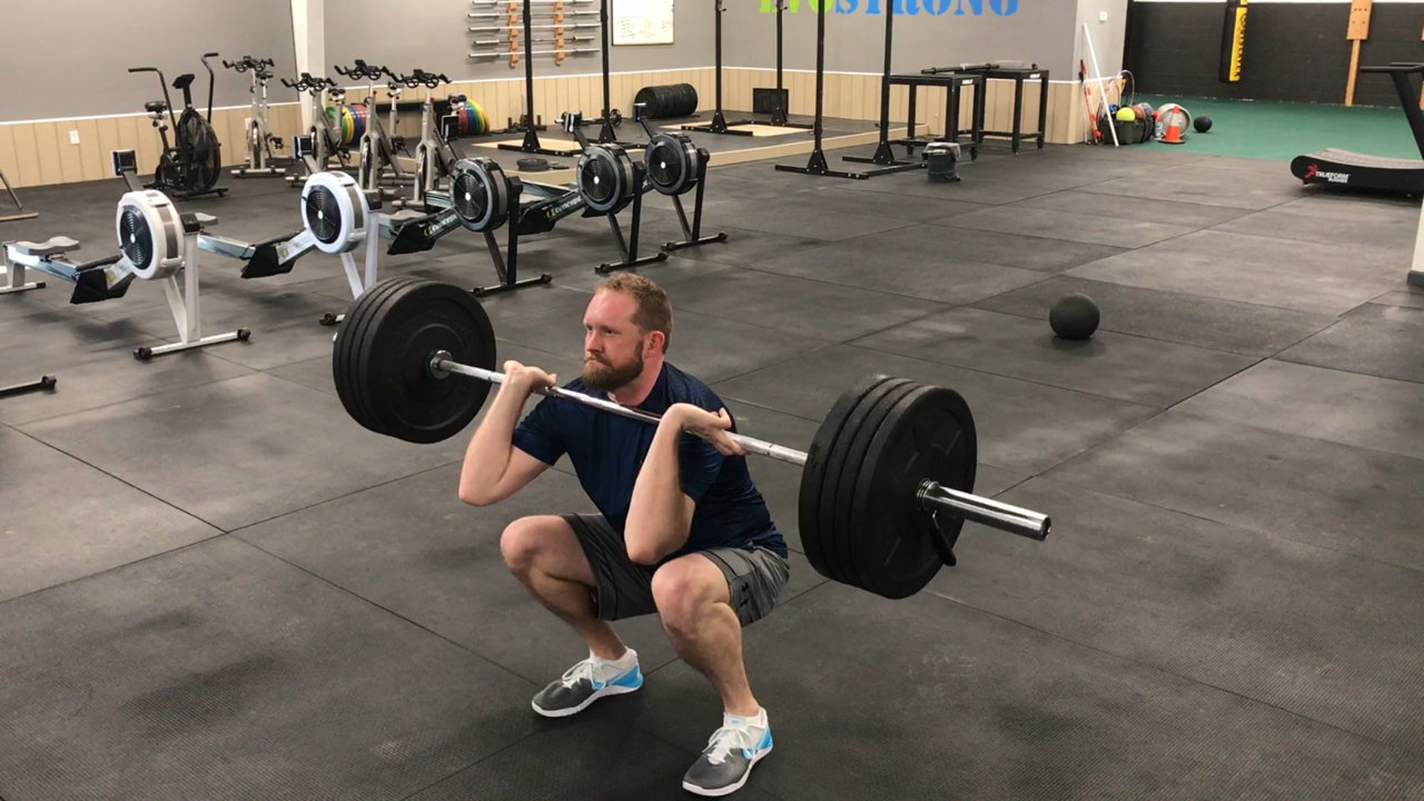 Man Doing Front Squat. Why do gains slow down after you have been working out for a while?